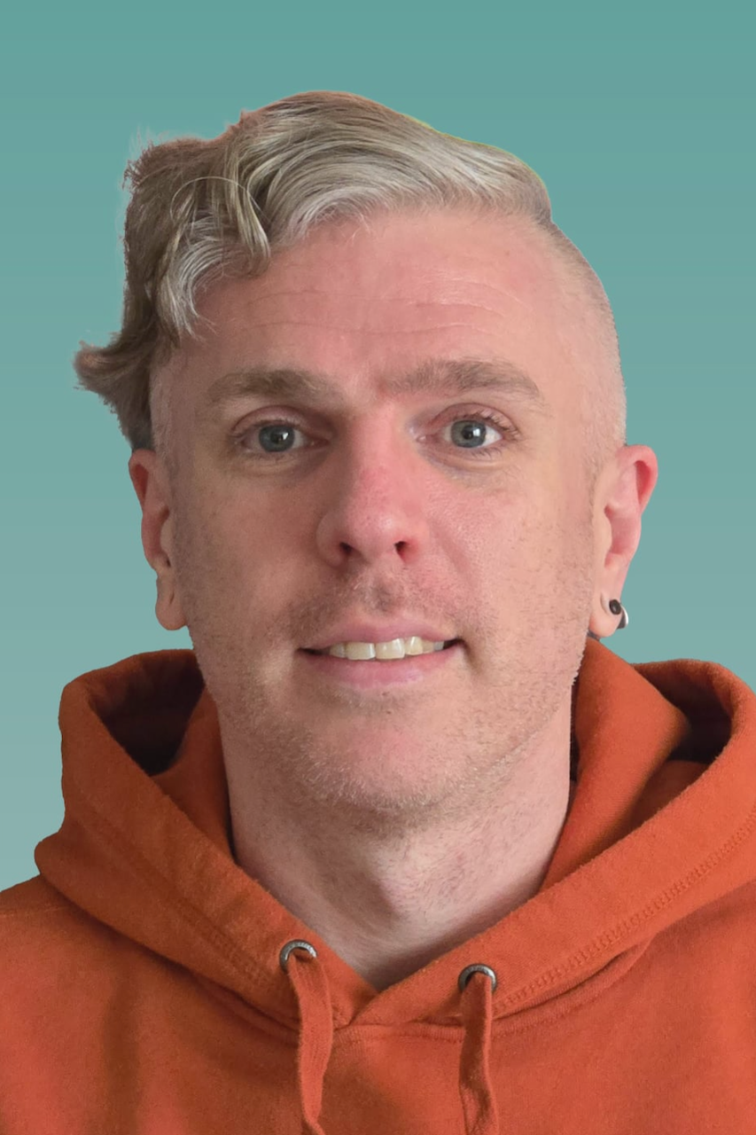 Michael Fox, BSW, MSW, RSW, psychotherapist in orange hoodie, providing family therapy, emotional regulation, and distress tolerance support.